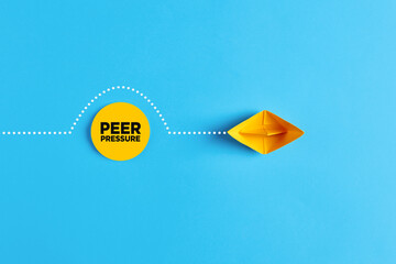 Paper boat overcomes the obstacle of peer pressure. To avoid or to deal with peer pressure - obrazy, fototapety, plakaty