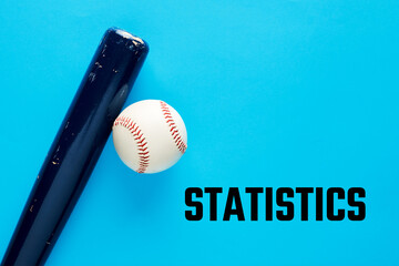 Baseball bat and a ball on blue background with the word statistics.
