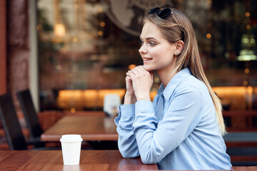 Business woman in a cafe outdoors fresh air summer