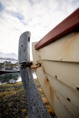 Siglufjörður Harbour Ship with cloudy but sunny sky in front of siglu hotel and harbour