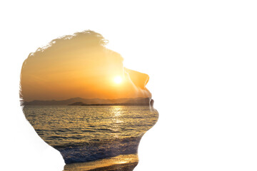 Combination of the silhouette of a man face and a seascape with a sunset. Concept of unity of...