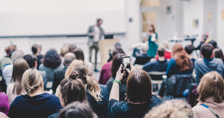 Fototapeta premium Man giving presentation in lecture hall at university.