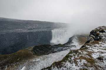 Dettifoss Watrfall Iceland  in winter snowy frozen grass