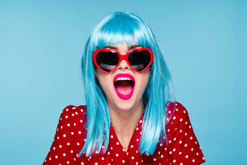 emotional woman blue wig sunglasses posing fashion
