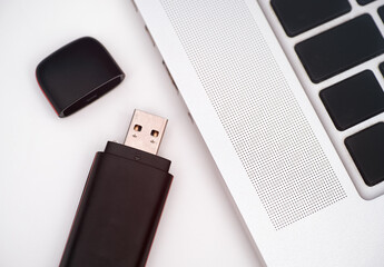 USB Flash Drive near laptop