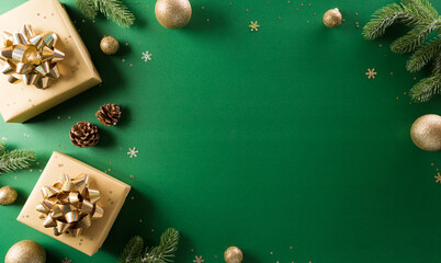Christmas and new year background concept. Top view of Christmas gift box, christmas ball and snowflake on green background.