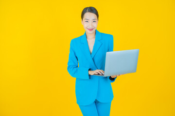 Portrait beautiful young asian woman smile with computer laptop