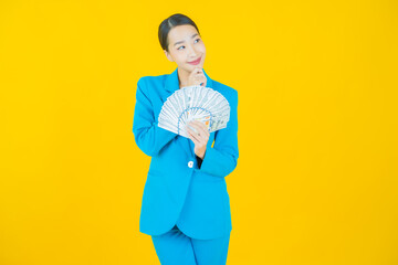 Portrait beautiful young asian woman smile with a lot of cash and money