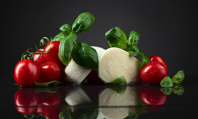 Mozzarella with basil and tomatoes.
