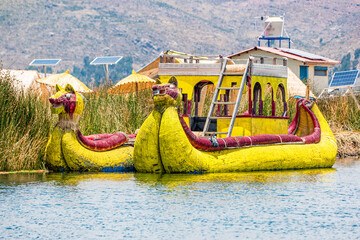 Traditional boat on the floating islands of Uros on Lake Titicaca in Peru - 473522618