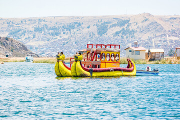 Traditional boat on the floating islands of Uros on Lake Titicaca in Peru