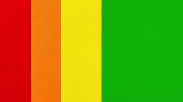 4k On red background colors appear LGBT flag and six small white hearts. LGBTQ community, sexuality and gender identity concept. Stop motion animation. Gay pride. Lesbian, gay, bisexual, transgender