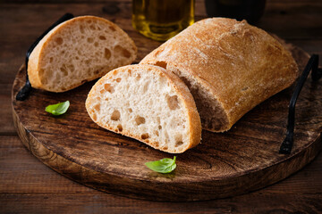 Ciabatta Bread on the wood tabled. Freshly baked traditional bread on wooden table.
