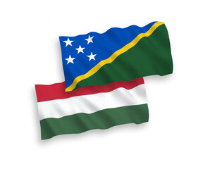 Flags of Solomon Islands and Hungary on a white background