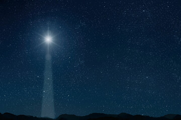 The star shines over the manger of christmas of Jesus Christ.