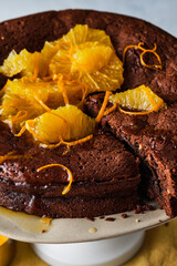 Chocolate cake with orange zest and citrus sauce. Brownie with orange.