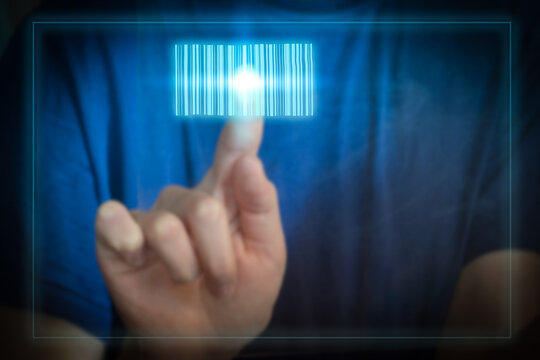 The businesswoman touches the barcode on the virtual tap. Scanning a hologram barcode on a tablet in your hand, warehouse and logistics. Modern management technologies