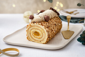 Buche de Noel. Traditional Christmas dessert, Christmas yule log cake with vanilla cream. Christmas...