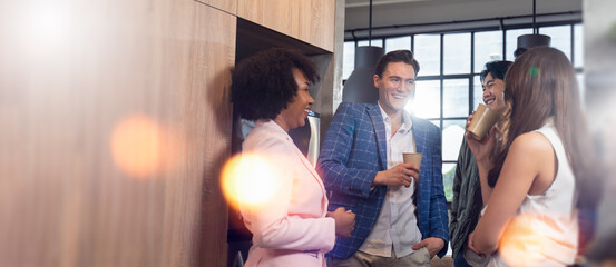 Happy multiracial young people friends talking laughing at group meeting,diverse students drinking...