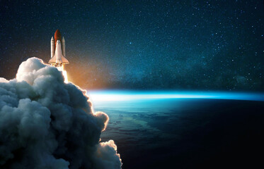 Space rocket lift off into cosmos with smoke and blast on a background of the blue planet earth. Spacecraft flies in space with a starry sky near the planet. Successful start of the mission - obrazy, fototapety, plakaty