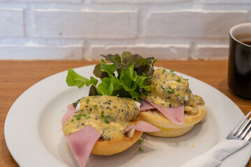 Eggs Benedis ham with mushroom sauce and salad for breakfast at restaurants and bakeries. 