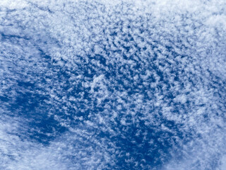 Small patchy clouds against a blue sky.
