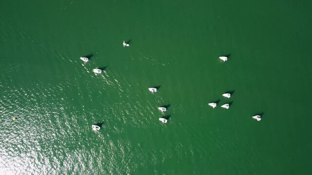 Aerial drone view of sailing boat on a river.