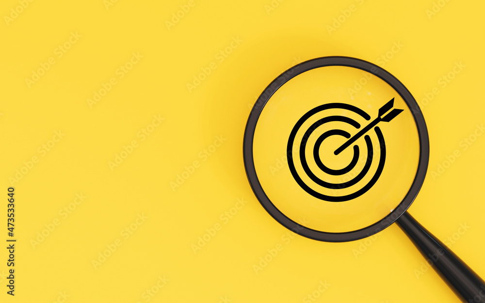 Poster target board inside of magnifier glass on yellow background and copy space for focus business object