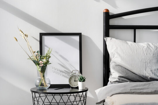 Home decor and picture frame with blank space on nightstand