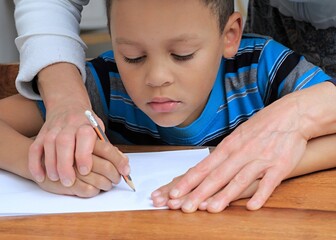 school boy learning at home educational distance learning stock photo