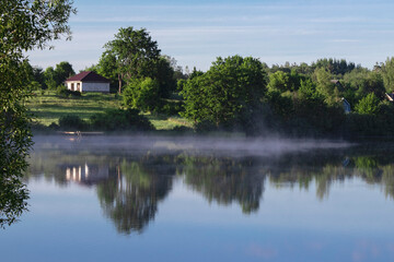 Fototapeta na wymiar Fog over the lake.