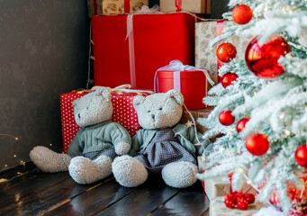 Christmas tree with gifts and teddy bear on chair. High quality photo