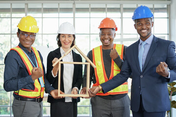 business engineering project manager with partnerships smiling and fist celebrating their success for strong teamwork