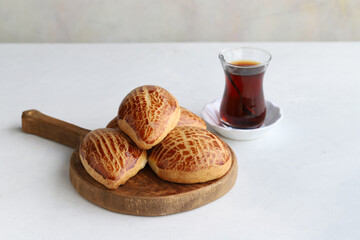 Turkish pastry product , tasty pogaca. Turkish Pastries on a white background. horizontal view. close up. Turkish breakfast.