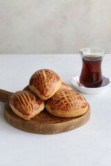 Turkish pastry product , tasty pogaca. Turkish Pastries on a white background. Vertical view. close up. Turkish breakfast.