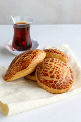 Turkish pastry product , tasty pogaca. Turkish Pastries on a white background. Vertical view. close up. Turkish breakfast.