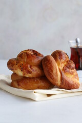 Turkish pastry product , tasty pogaca. Turkish Pastries on a white background. Vertical view. close up. Turkish breakfast.