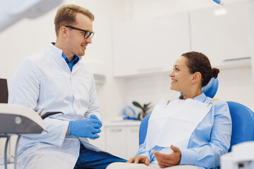 Client and dentist talking about treatment procedure