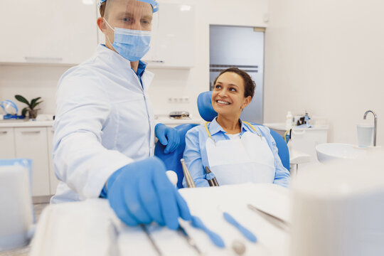 Dentist preparing medical tools for patient