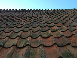 Pattern made from old tiles on roof