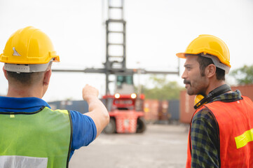 foreman team are working at container yard, logistic cargo warehouse for industrial shipping