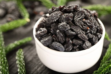 Bowl of healthy and delicious sun dried black grapes,, raisins, 