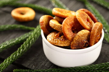 Bowl of delicious sundried fig fruits, healthy vegan diet foods.