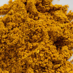Detailed and large close up shot of powdered curry spice.