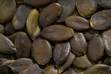 Detailed and large close up shot of pumpkin seeds.