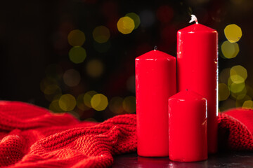 Red christmas candles on bokeh background