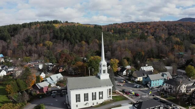 Aerial panorama of famous small town Stove in Vermont. Sunny day with clouds in autumn season.