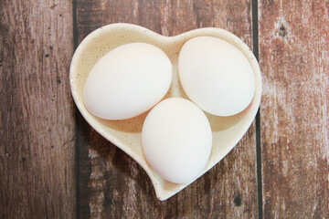 Fototapeta na wymiar round white chicken eggs with hard shells