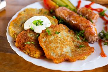 belarusian pancakes with sausages in a restaurant