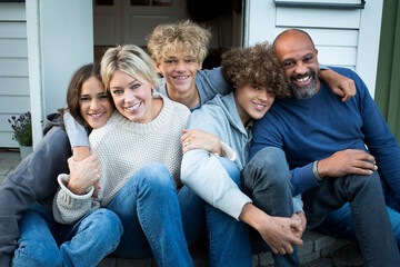 Portrait of happy mother and father with children